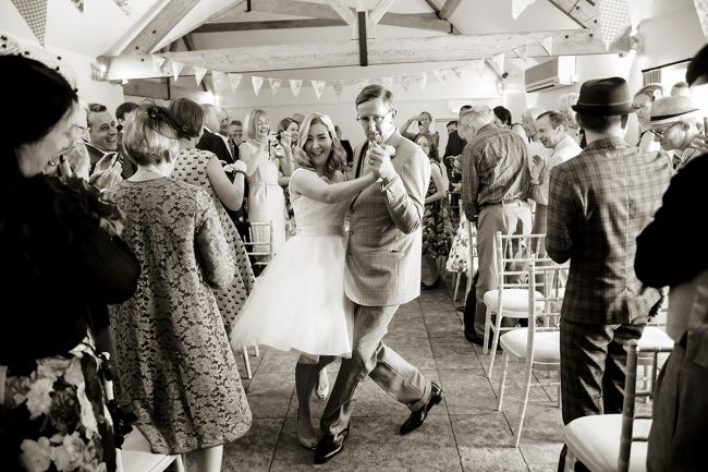 Farbridge wedding venue – 1 a bride & groom waltzing down the aisle together at Farbridge