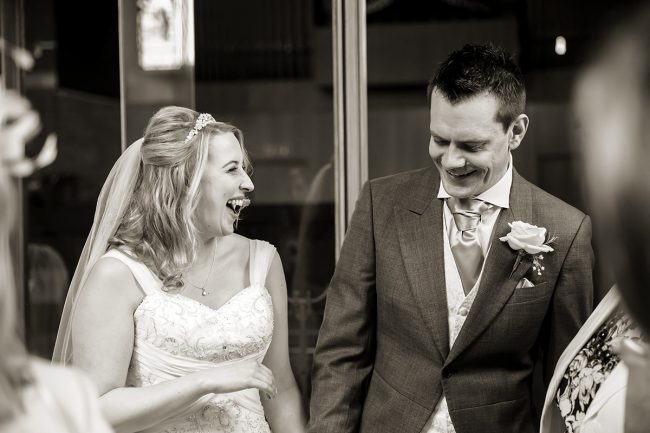 East-Sussex-wedding-1 bride laughing at the groom