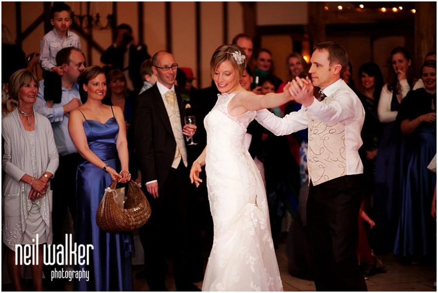 A bride & groom dancing at a wedding at Upwaltham Barns in Sussex