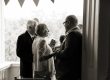 groom talking to a guest a touching moment