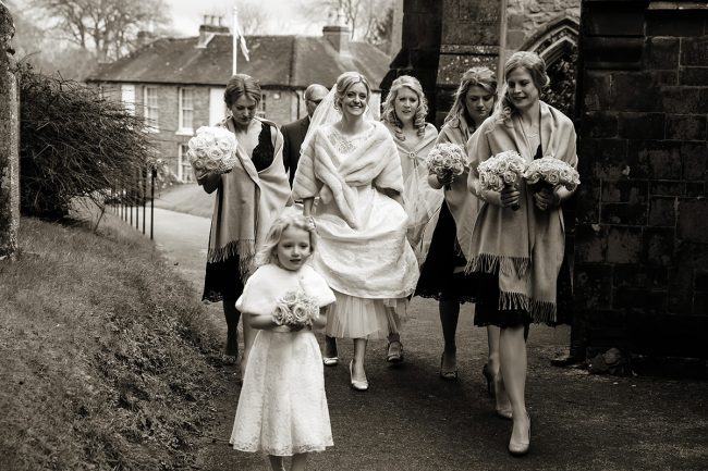 Farbridge-Barn-wedding-2 bride walking with her bridesmaids to the church laughing