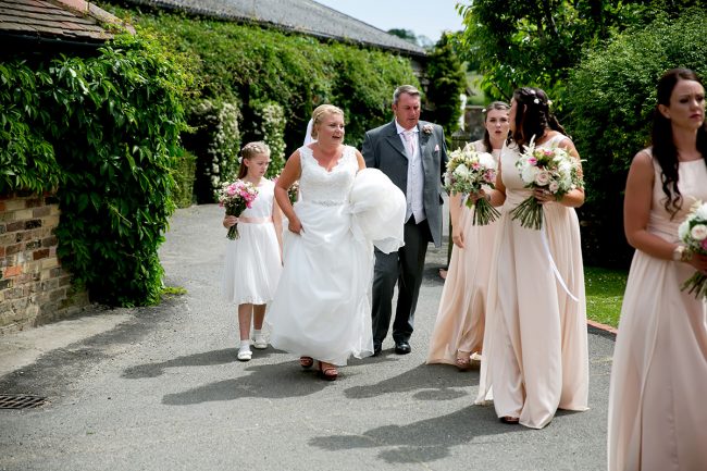 Selden-Barn-wedding-1 bride walking to her wedding ceremony