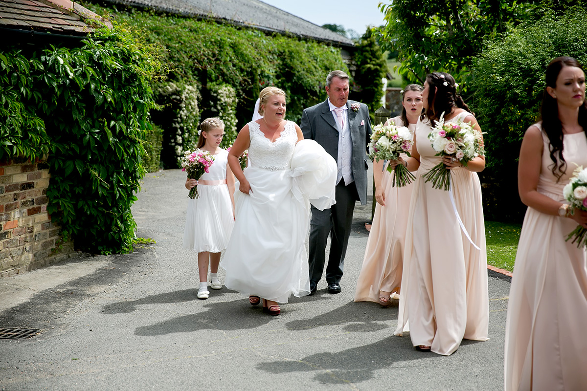 bride walking to her wedding ceremony