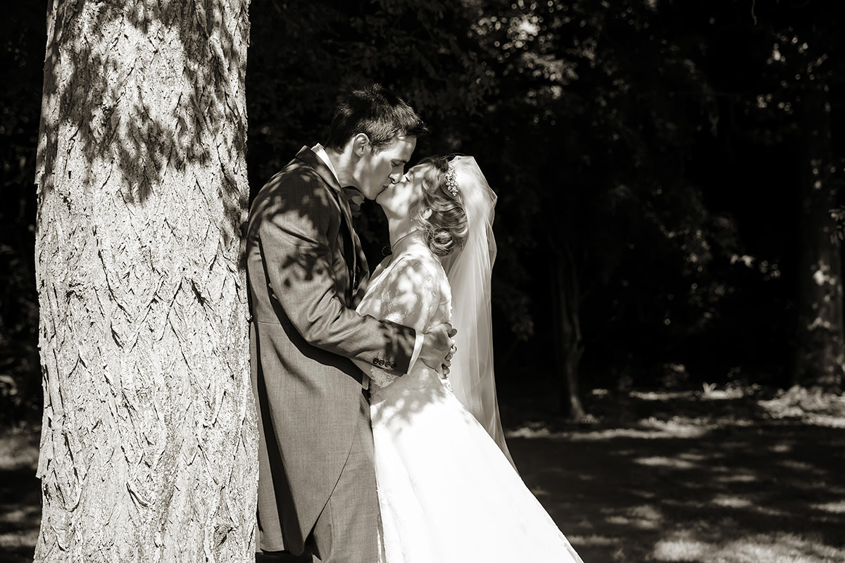 a bride & groom at a wedding at Horsted Place
