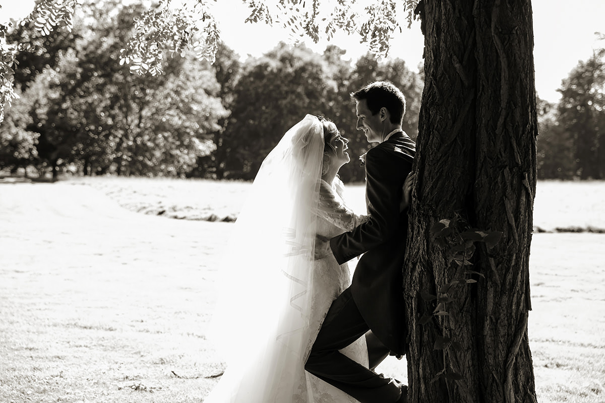 a bride & groom together after their ceremony at their Horsted Place wedding