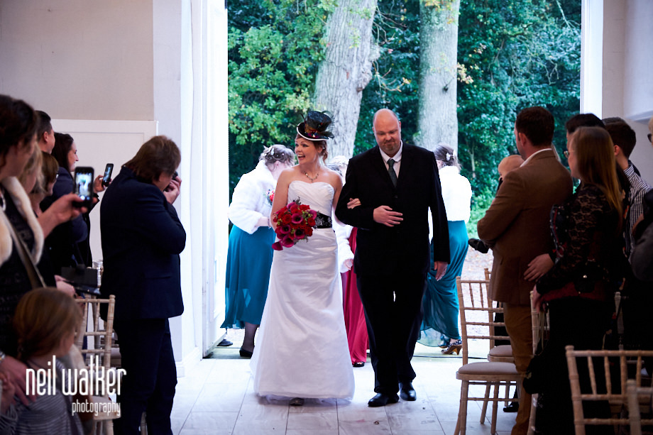 the bride walking into the Ceremonial Hall at Castle Goring for her wedding ceremony