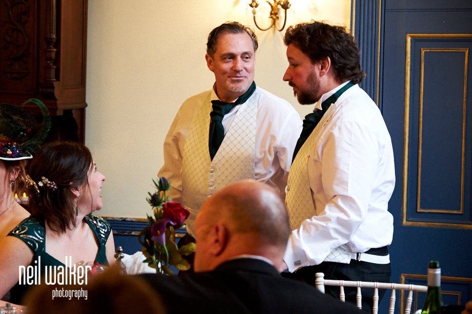 the best man talking to a groomsman