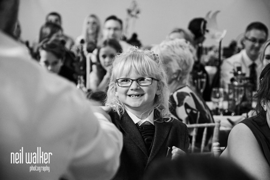 the bride and groom's daughter laughing during her speech