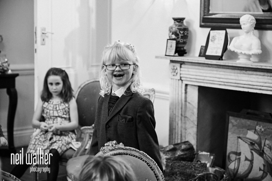 the bride and groom's daughter laughing