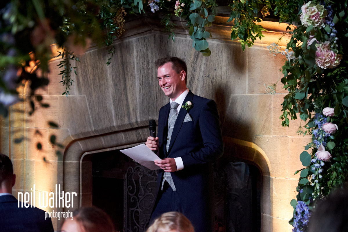 the groom laughing during his speech