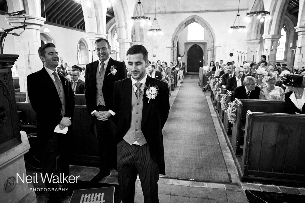 the groom waiting for his bride in the church