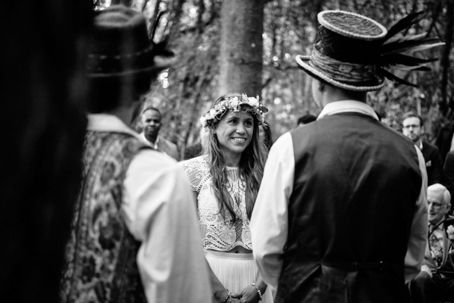 The bride looking at the groom during their wedding ceremony at Wilderness Wood.