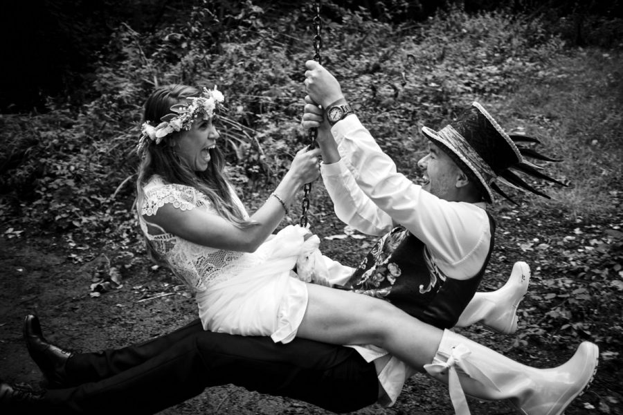 A bride and groom on a zip wire.